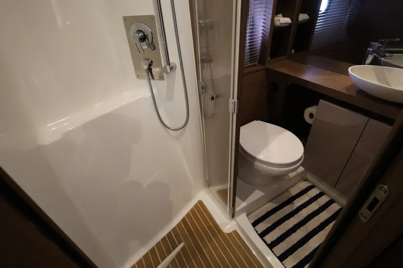 Slide: The Image of Luxurious bathroom in 2019 Beneteau Gran Turismo 50 yacht with shower and modern fixtures. - 27