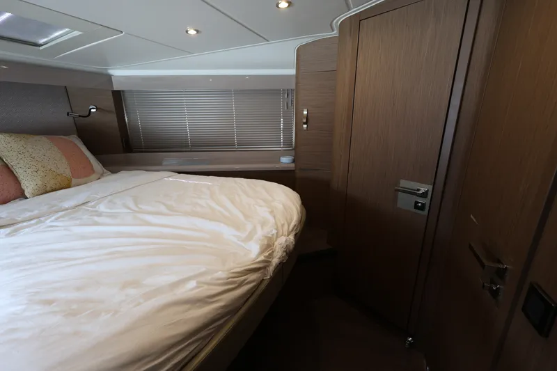 Slide: The Image of Luxurious cabin interior of 2019 Beneteau Gran Turismo 50 yacht with cozy bedding. - 26