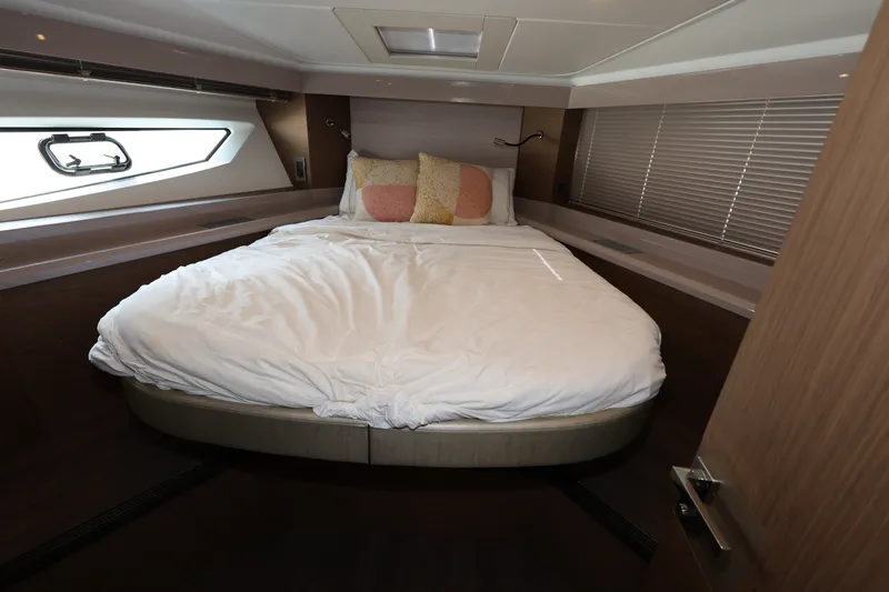 Slide: The Image of Luxurious bedroom interior of 2019 Beneteau Gran Turismo 50 yacht with cozy bedding. - 25