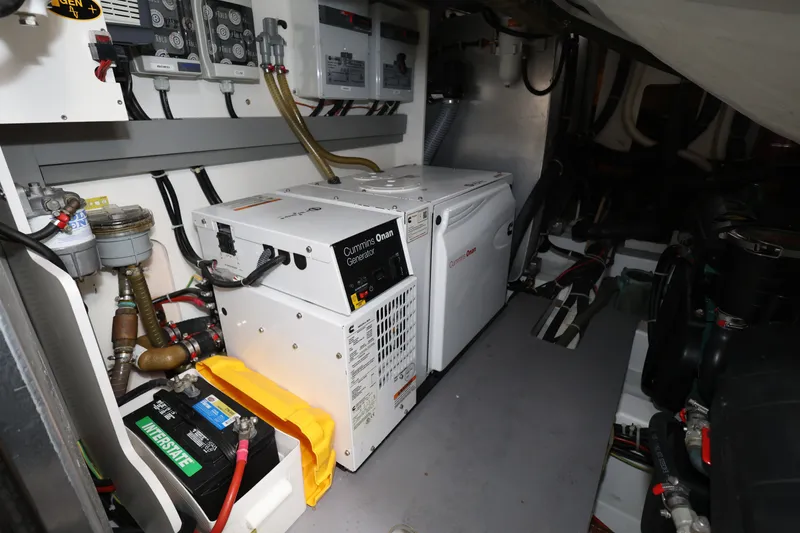 Slide: The Image of Engine room of 2019 Beneteau Gran Turismo 50 with Cummins Onan generator and Interstate battery. - 40