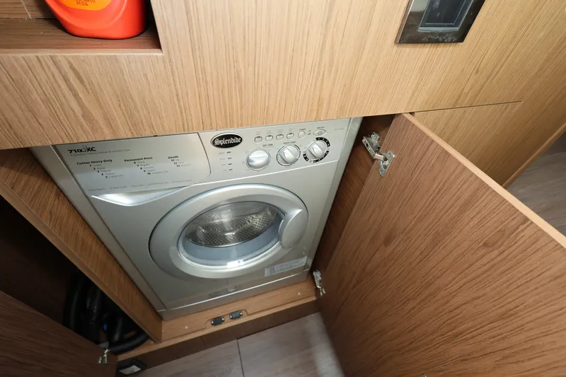 Slide: The Image of Laundry area with Splendide washer in 2019 Beneteau Gran Turismo 50 yacht. - 31