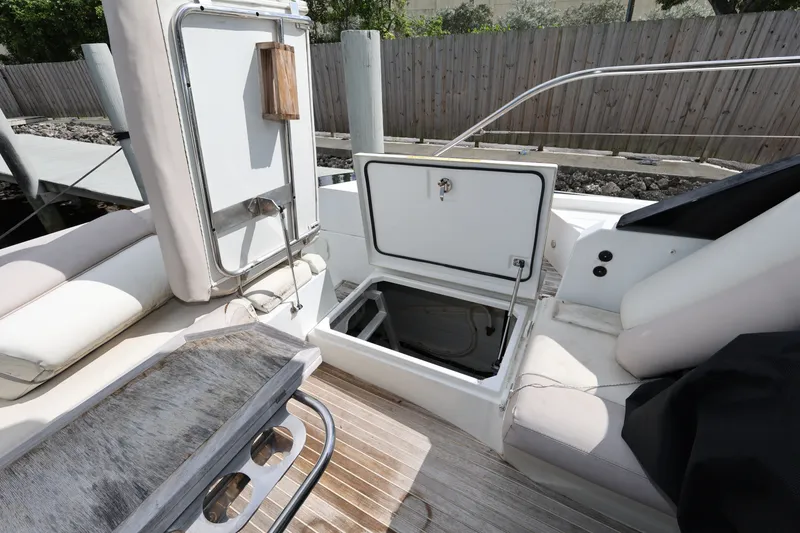 Slide: The Image of 2019 Beneteau Gran Turismo 50 yacht interior with open storage compartment and seating area. - 15