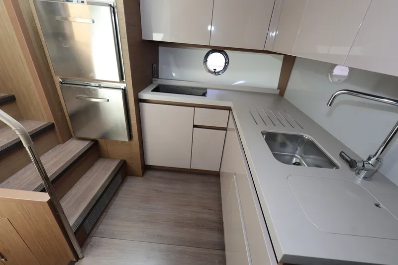 Slide: The Image of Modern kitchen interior of 2019 Beneteau Gran Turismo 50 yacht with sleek cabinetry and appliances. - 24