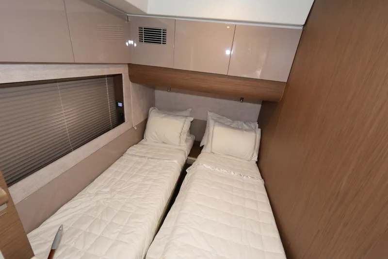 Slide: The Image of Interior cabin of 2019 Beneteau Gran Turismo 50 with twin beds and modern decor. - 30