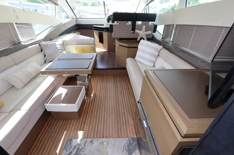 Slide: The Image of Luxurious interior of 2019 Beneteau Gran Turismo 50 yacht with elegant seating and modern design. - 16