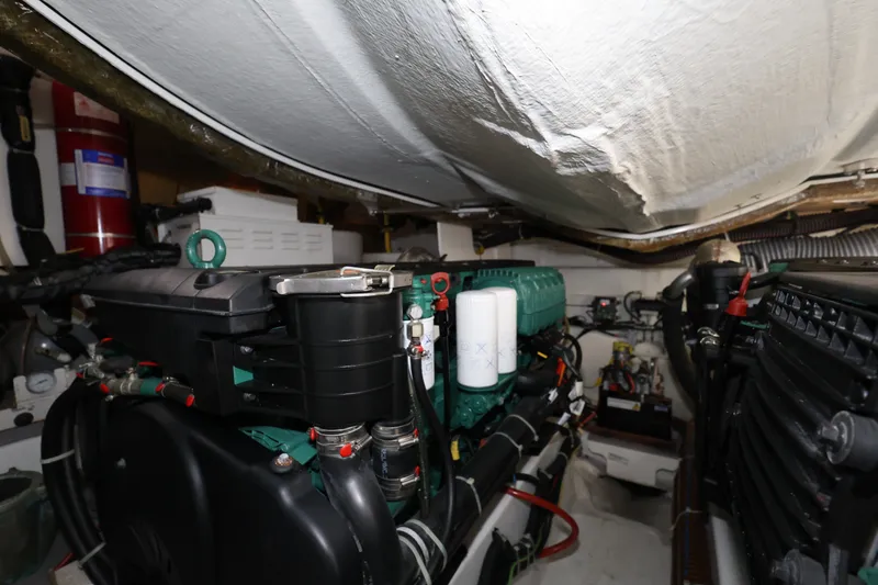 Slide: The Image of Engine room of 2019 Beneteau Gran Turismo 50 yacht, showcasing mechanical components. - 42