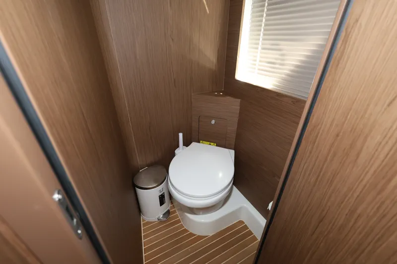 Slide: The Image of 2019 Beneteau Gran Turismo 50 yacht bathroom with wooden interior and modern fixtures. - 35