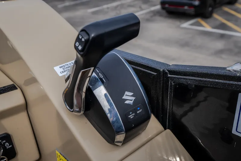 Slide: The Image of 2023 Crest Caribbean LX 250 throttle control with Suzuki branding. - 35