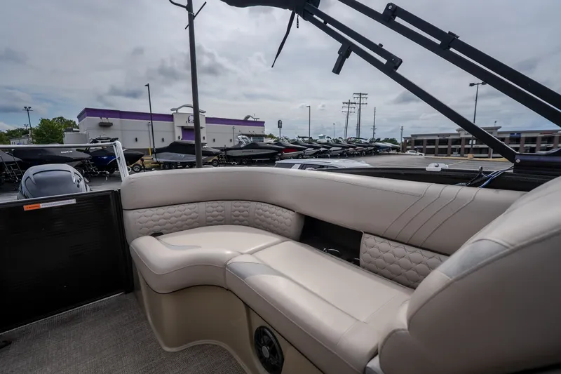 Slide: The Image of 2023 Crest Caribbean LX 250 boat interior with luxurious seating and modern design. - 57