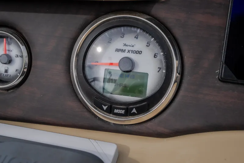 Slide: The Image of Close-up of 2023 Crest Caribbean LX 250 RPM gauge on dashboard. - 39