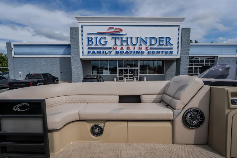 Slide: The Image of 2023 Crest Caribbean LX 250 boat at Big Thunder Marine dealership entrance. - 49