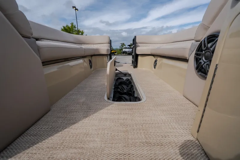 Slide: The Image of 2023 Crest Caribbean LX 250 interior with beige seating and carpeted flooring. - 53