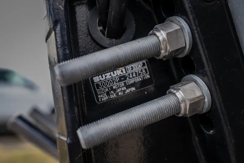 Slide: The Image of Close-up of Suzuki motor label and bolts on 2023 Crest Caribbean LX 250. - 41
