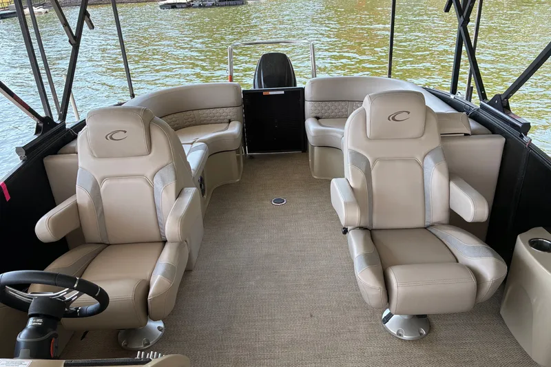Slide: The Image of 2023 Crest Caribbean LX 250 boat interior with luxurious seating and lake view. - 14