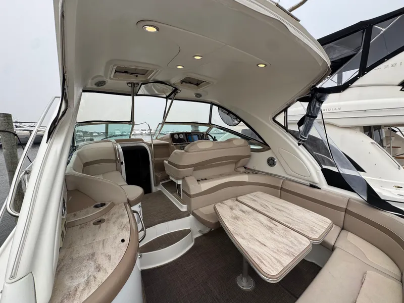Slide: The Image of The image shows the cockpit of a 2016 Formula 40 Performance Cruiser with beige seating and wooden tables. - 18