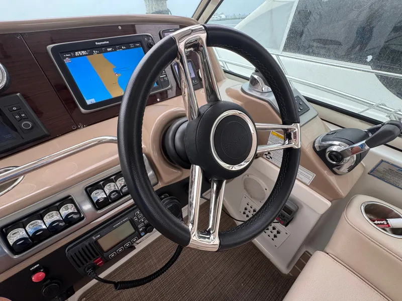 Slide: The Image of Helm of the 2016 Formula 40 Performance Cruiser with modern navigation system and sleek design. - 12