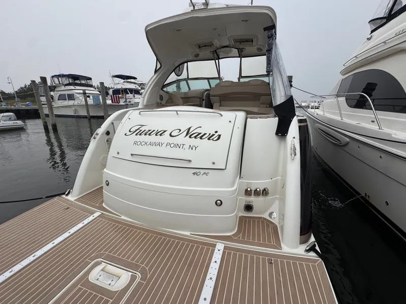 Slide: The Image of Rear view of a 2016 Formula 40 Performance Cruiser, docked with an open cockpit. - 4