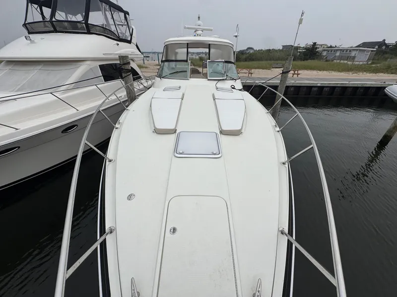 Slide: The Image of A 2016 Formula 40 Performance Cruiser docked. The deck is clean and spacious. - 16