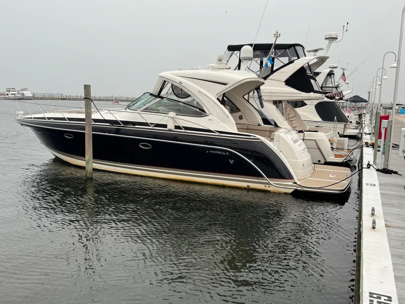 Slide: The Image of A 2016 Formula 40 Performance Cruiser docked. It features a sleek, modern design. - 3