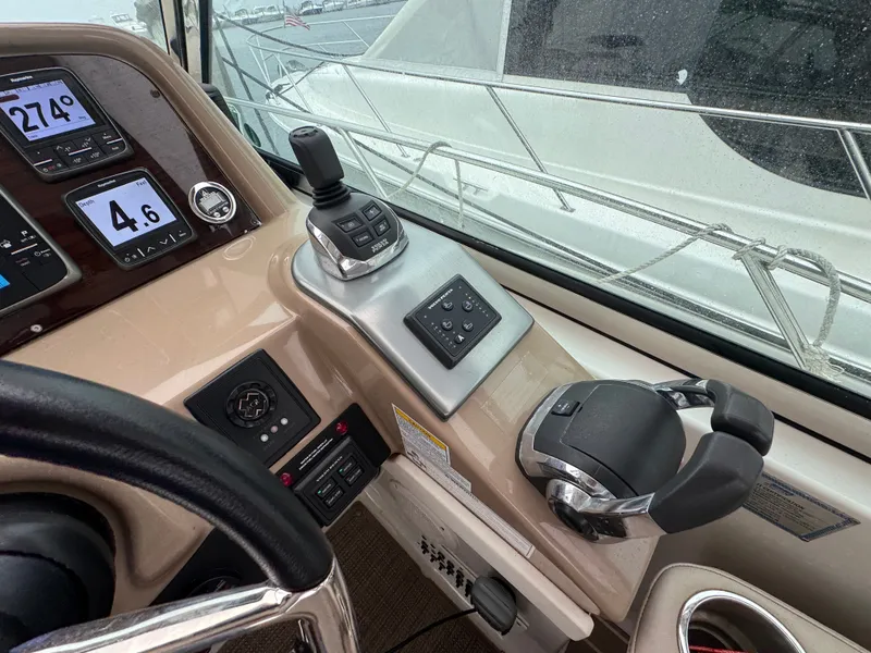 Slide: The Image of The cockpit of the 2016 Formula 40 Performance Cruiser with modern control and navigation instruments. - 11
