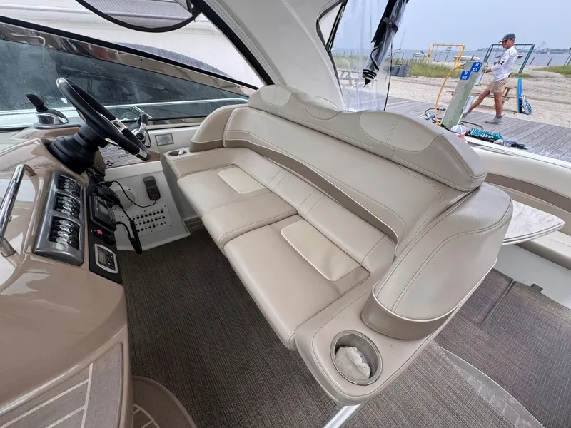 Slide: The Image of The image shows the cockpit of a 2016 Formula 40 Performance Cruiser with beige leather seating and a modern helm. - 10