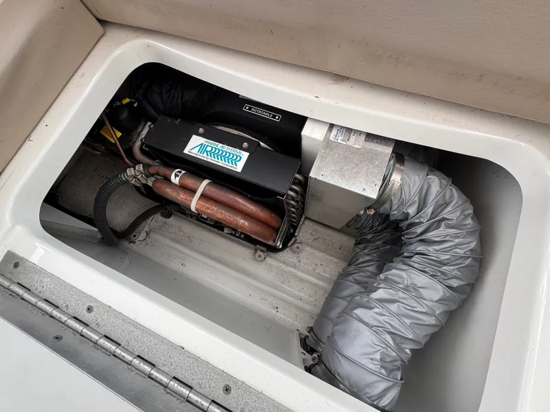 Slide: The Image of A view of the engine compartment of a 2016 Formula 40 Performance Cruiser with ventilation hoses. - 14