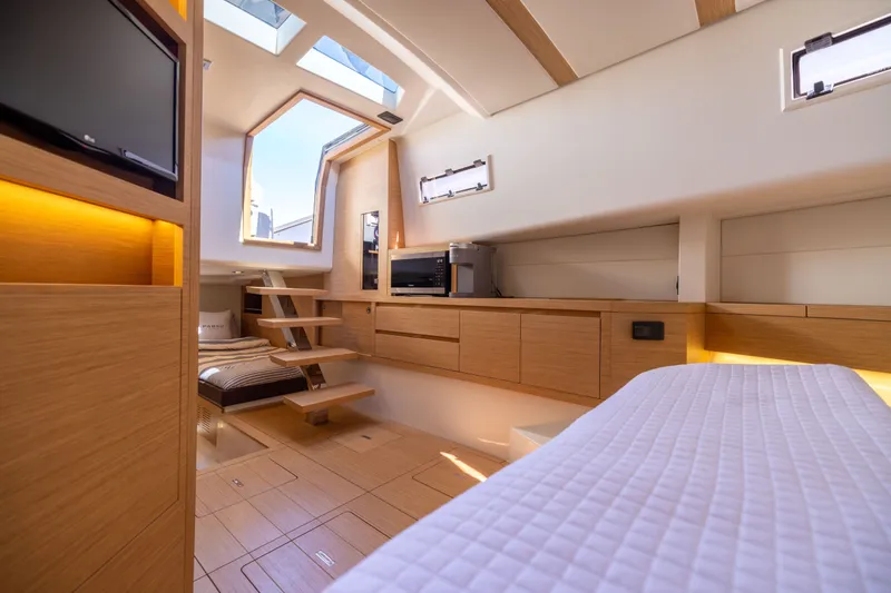 Slide: The Image of Luxurious interior of 2023 Pardo Yachts 43, featuring modern wood finishes and skylights. - 52