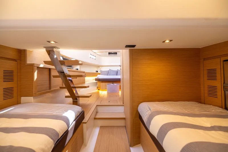 Slide: The Image of Luxurious interior of 2023 Pardo Yachts 43, featuring modern wood finishes and cozy sleeping area. - 58