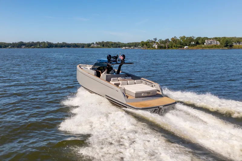 Slide: The Image of 2023 Pardo Yachts 43 cruising on a scenic lake under clear blue skies. - 68