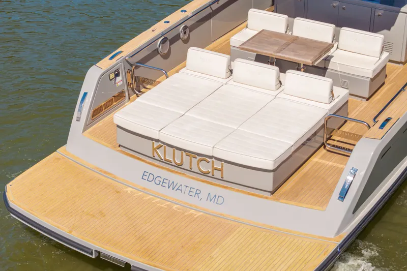 Slide: The Image of Luxury Pardo Yachts 43, 2023 model, featuring spacious deck and seating, docked in Edgewater, MD. - 18