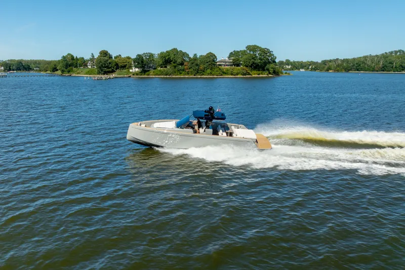 Slide: The Image of 2023 Pardo Yachts 43 cruising on a scenic lake under clear blue skies. - 3