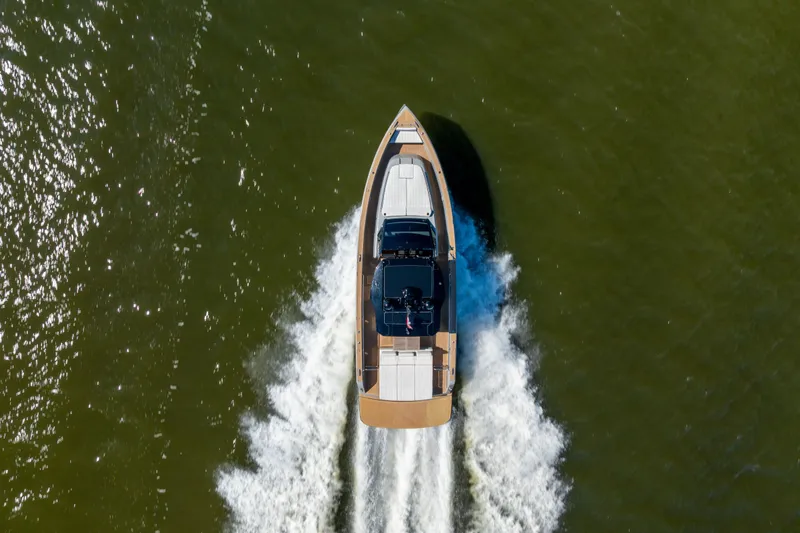 Slide: The Image of Aerial view of 2023 Pardo Yachts 43 cruising on water, leaving a wake. - 8
