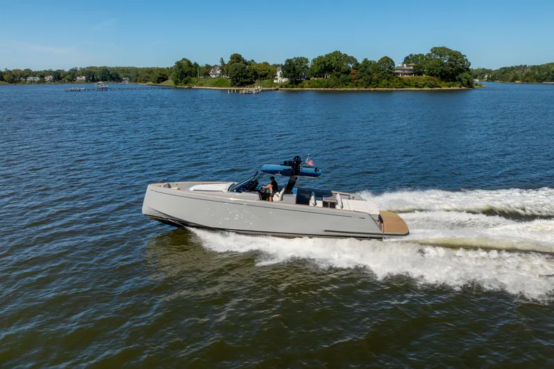 Slide: The Image of 2023 Pardo Yachts 43 cruising on a scenic lake under clear blue skies. - 70