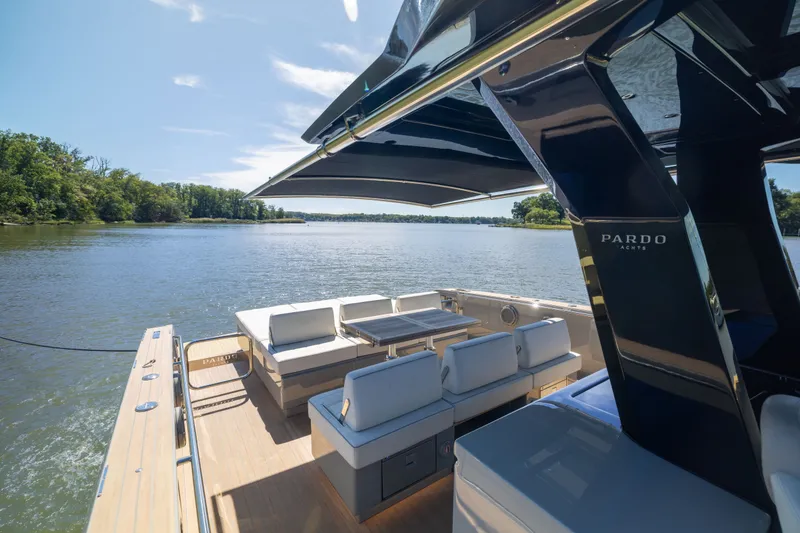 Slide: The Image of Luxurious 2023 Pardo Yachts 43 on serene water, featuring elegant seating and sleek design. - 35