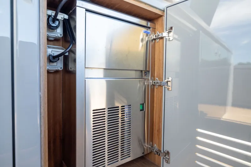 Slide: The Image of Stainless steel appliance inside Pardo Yachts 43, 2023 model, with wooden cabinetry. - 39