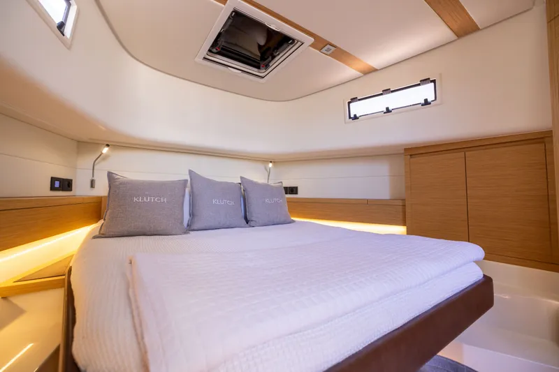 Slide: The Image of Luxurious cabin interior of 2023 Pardo Yachts 43, featuring elegant bedding and modern design. - 50