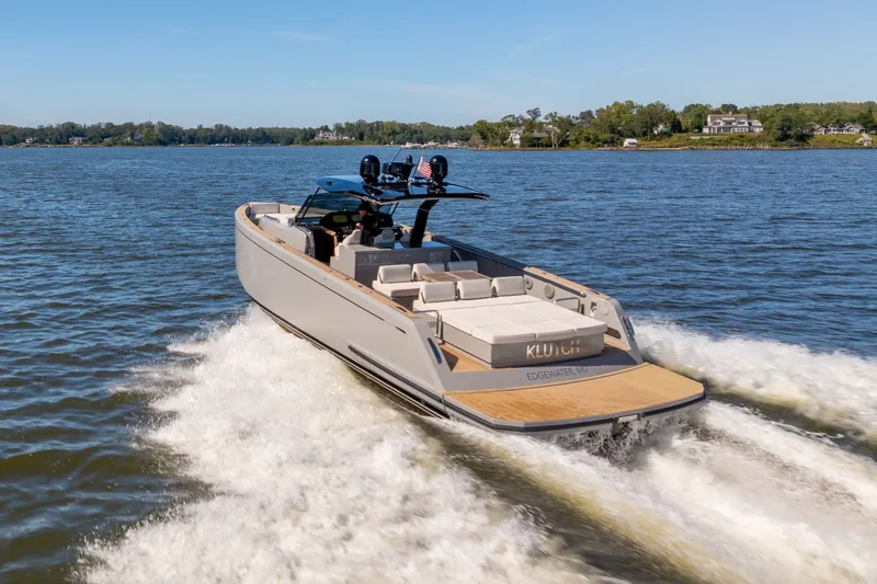 Slide: The Image of 2023 Pardo Yachts 43 cruising on a serene lake under clear skies. - 6