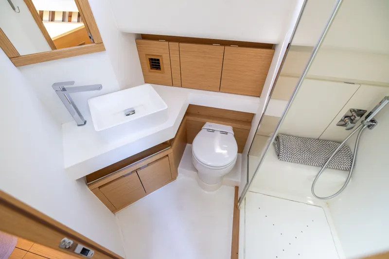 Slide: The Image of Modern bathroom in 2023 Pardo Yachts 43, featuring sleek fixtures and wooden cabinetry. - 61