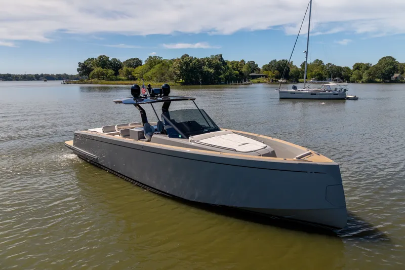 Slide: The Image of 2023 Pardo Yachts 43 cruising on a serene lake with lush greenery. - 64