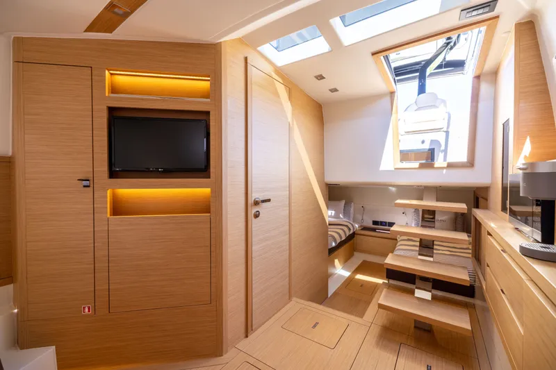 Slide: The Image of Luxurious interior of 2023 Pardo Yachts 43 with modern wood finish and skylight. - 51
