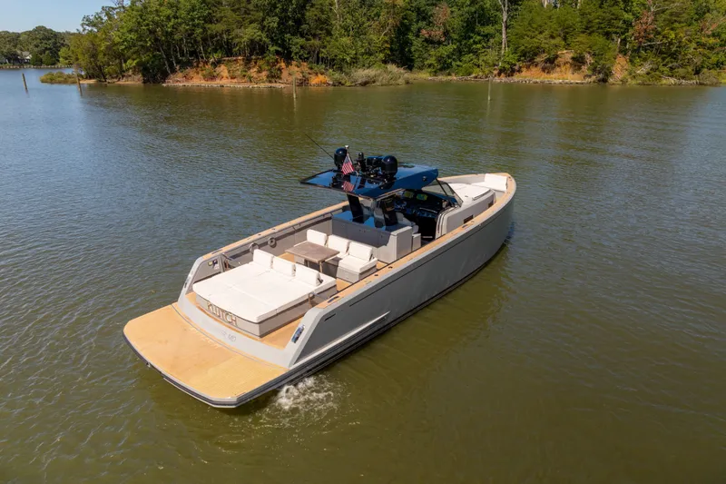 Slide: The Image of 2023 Pardo Yachts 43 cruising on a serene river with lush green surroundings. - 14