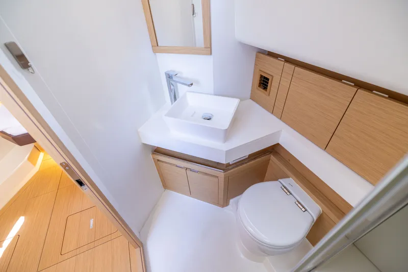 Slide: The Image of Modern bathroom in 2023 Pardo Yachts 43, featuring sleek sink and wooden cabinetry. - 62