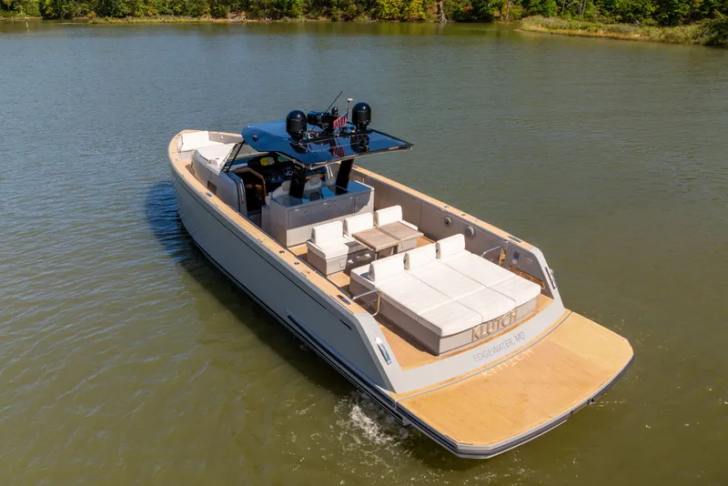 Slide: The Image of Luxury 2023 Pardo Yachts 43 cruising on a serene lake, showcasing sleek design and spacious deck. - 12