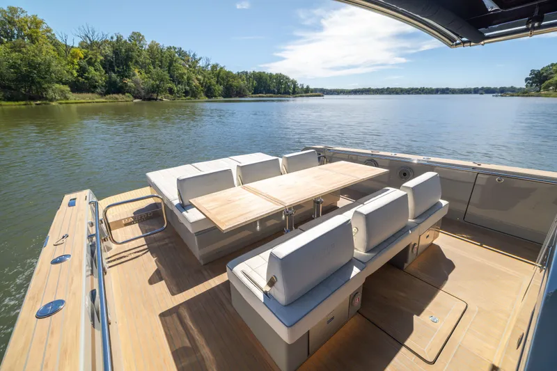 Slide: The Image of Luxurious 2023 Pardo Yachts 43 with elegant seating and scenic water view. - 45
