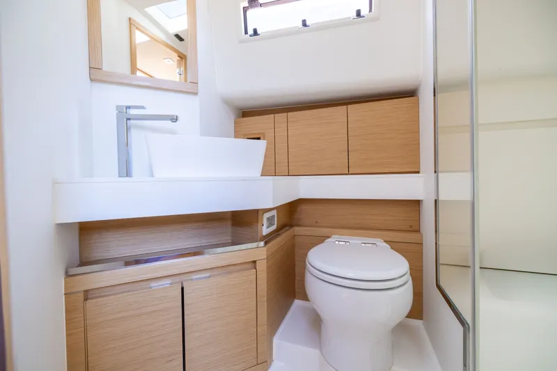 Slide: The Image of Modern bathroom interior on 2023 Pardo Yachts 43, featuring sleek fixtures and wooden cabinetry. - 60