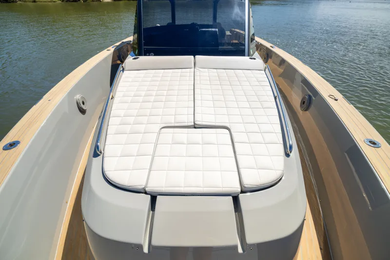 Slide: The Image of 2023 Pardo Yachts 43 with luxurious sunbed on deck, cruising on calm waters. - 25