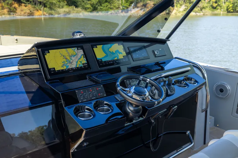 Slide: The Image of Helm of 2023 Pardo Yachts 43 with advanced navigation displays and controls. - 29