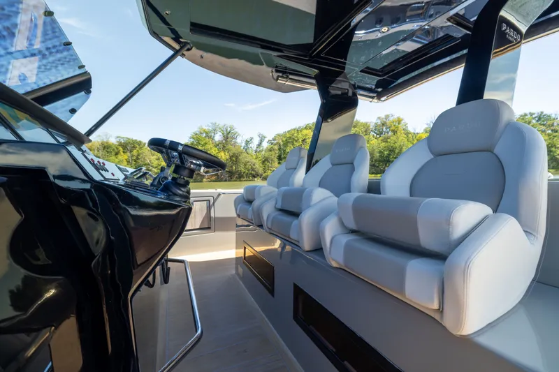 Slide: The Image of Interior of 2023 Pardo Yachts 43, featuring luxurious seating and modern helm design. - 33