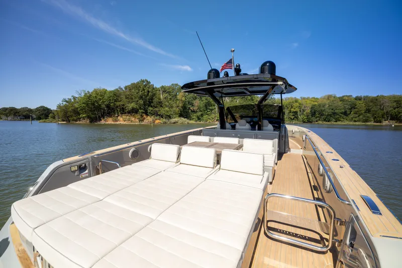 Slide: The Image of 2023 Pardo Yachts 43 on serene water, featuring spacious deck and luxurious seating. - 46
