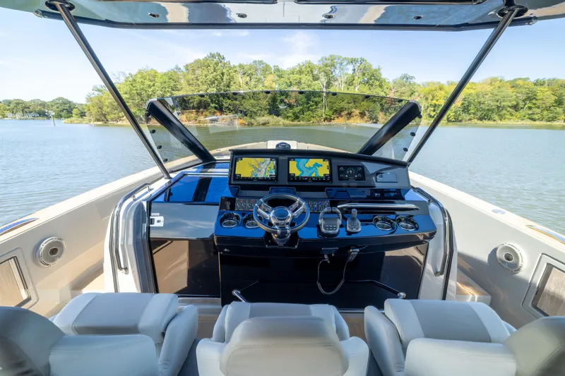 Slide: The Image of Cockpit view of 2023 Pardo Yachts 43, featuring modern navigation systems and luxurious seating. - 27